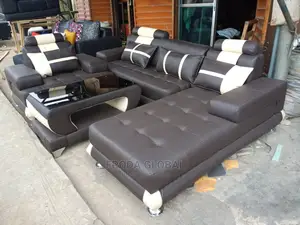 L-Shaped Sofa With a Single Seater Chair and Table