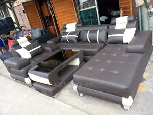 L-Shaped Sofa With a Single Seater Chair and Table