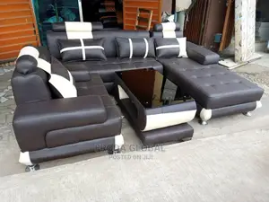 L-Shaped Sofa With a Single Seater Chair and Table