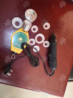 Electric Hand Capping Machine.