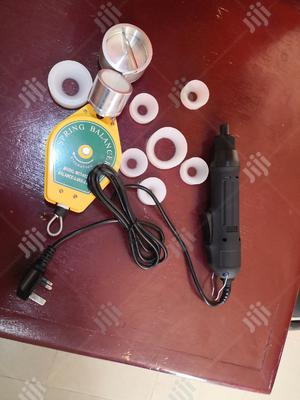 Electric Hand Capping Machine.