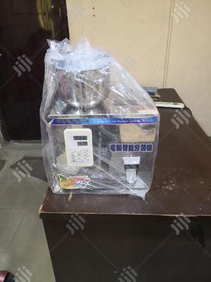 Semi Auto Granule Filling Machine.