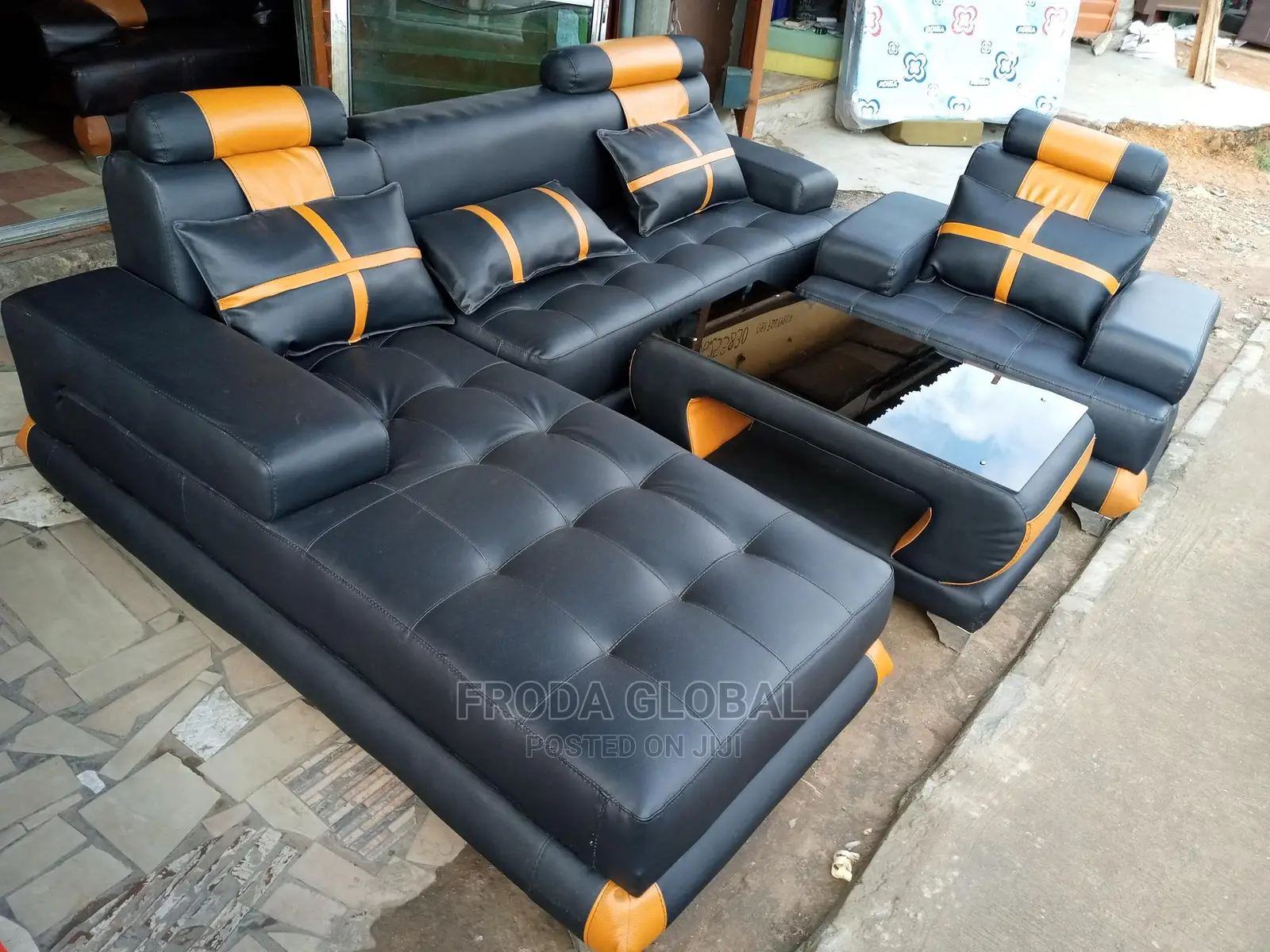 L-Shaped Sofa With a Single Seater Chair and Table