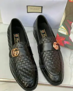 Gucci Embossed GG Loafers