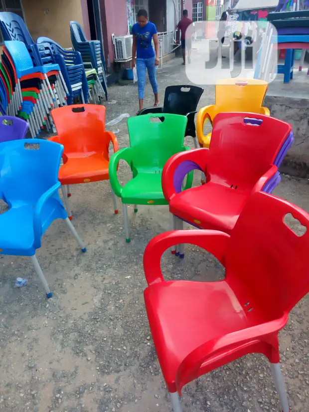 Strong Iron Leg Plastic Chair With Arm Rest in Isolo Furniture