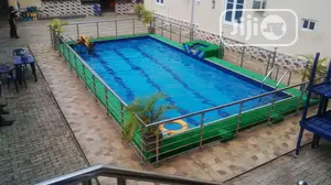 Redefined Your Pool Surrounding With Green Grass Rugs