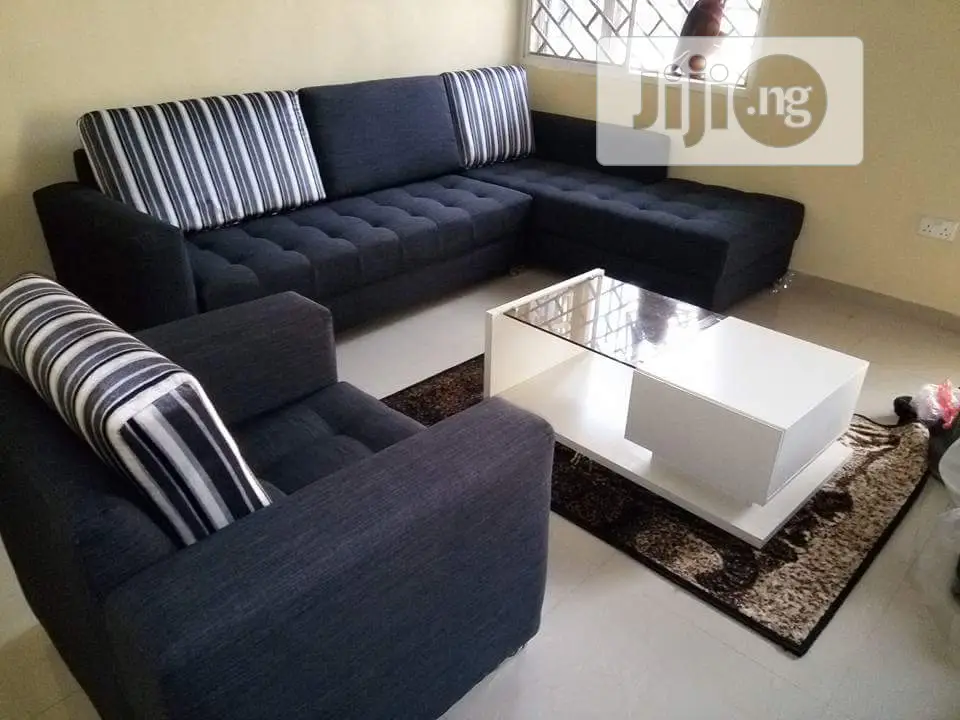 L-Shaped Fabric Sofa With a Single and Center Table