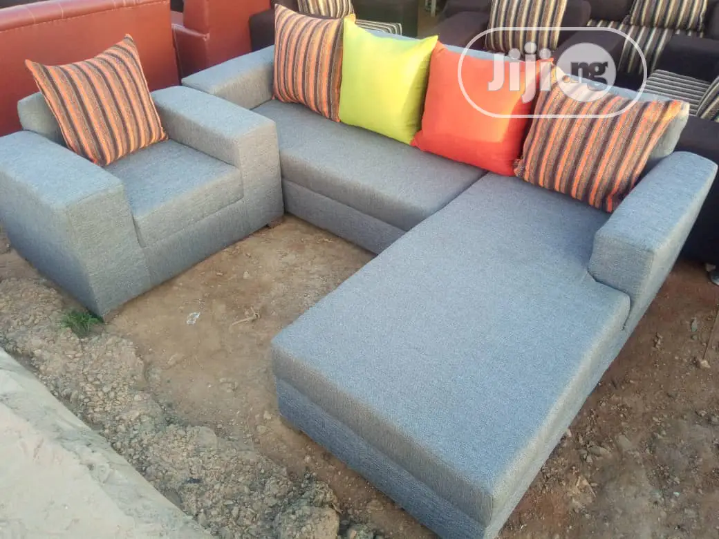 L Shaped Sofa With Multicoloured Pillows