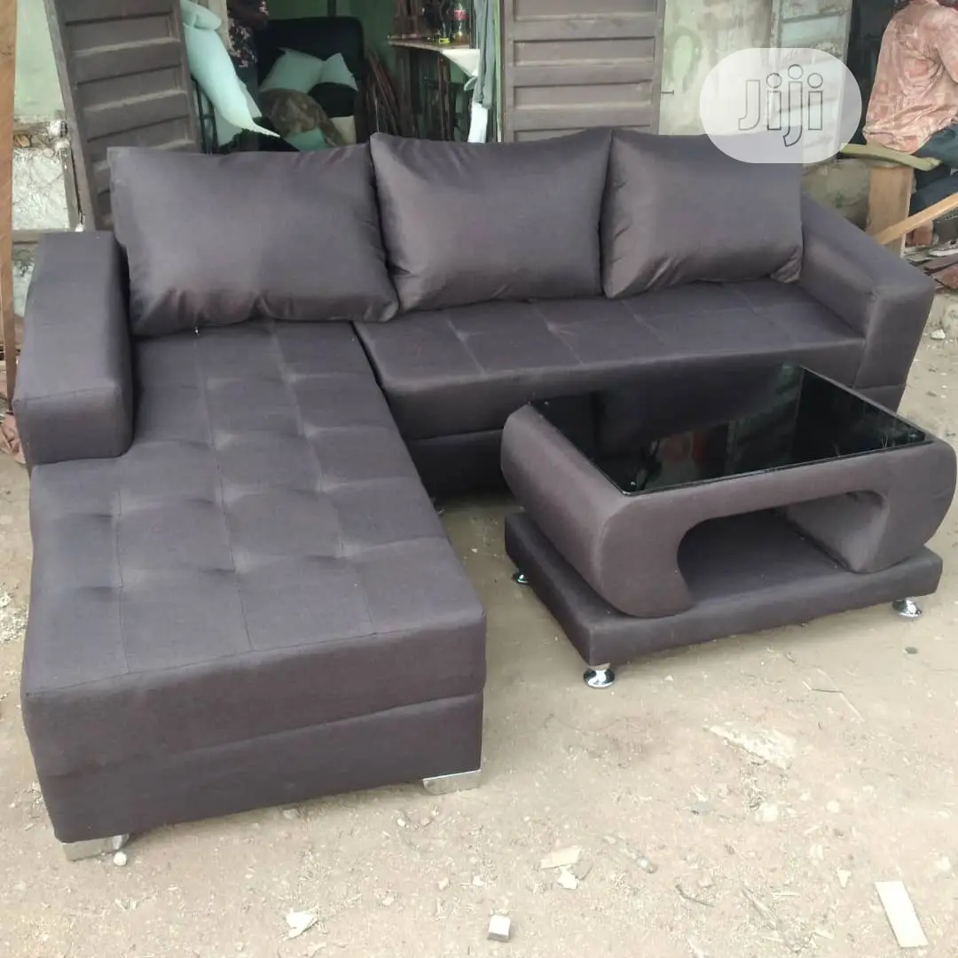 Brown L- Shaped Sofa With Center Table