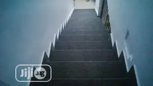 Transformation of Rough Staircase With Smooth Grey Rug