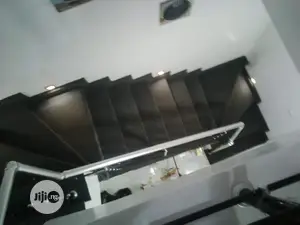 Redefine Your Staircase With Plain Grey Rugs