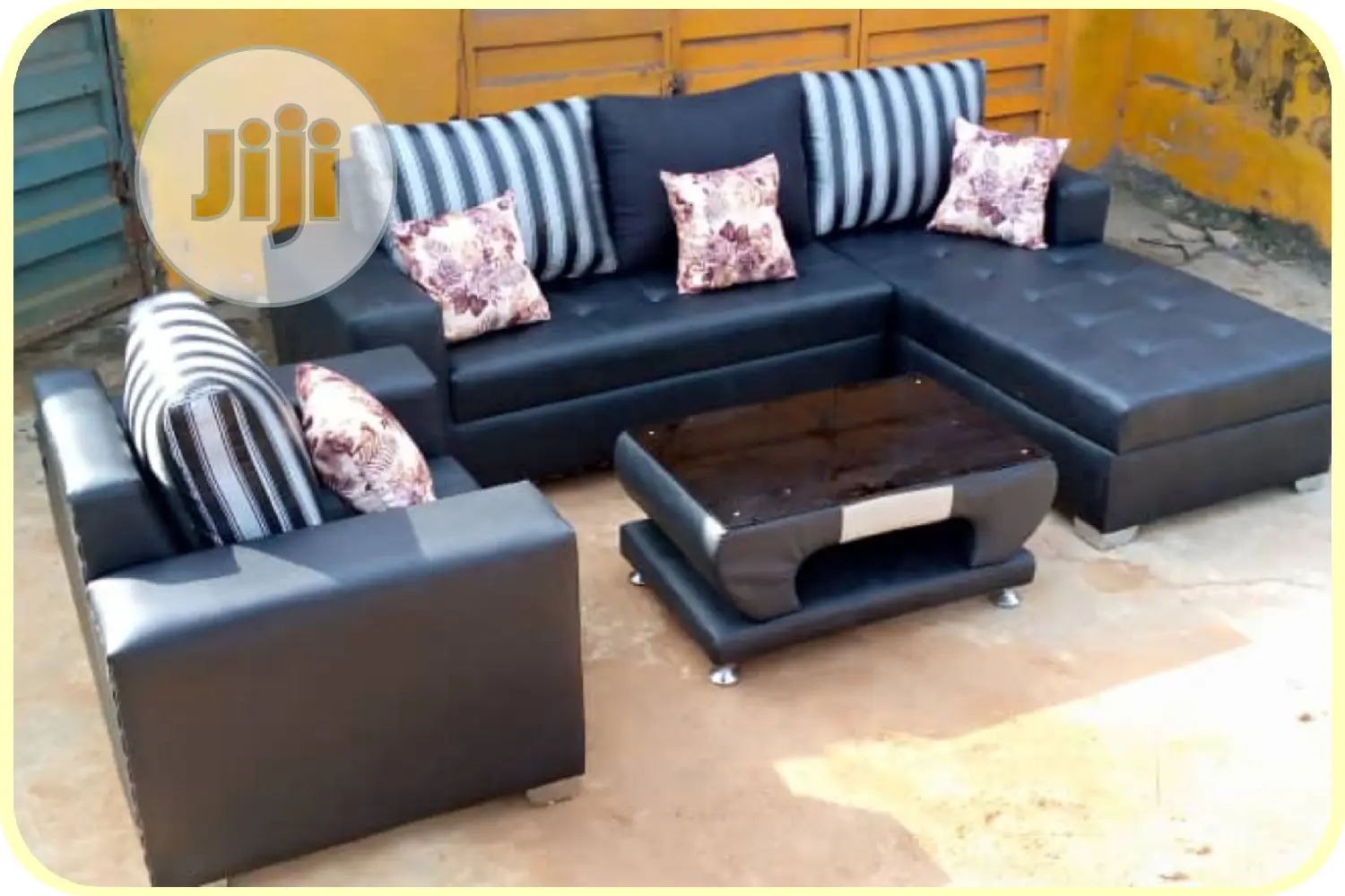 L-Shaped Leather Sofa With a Single and Center Table