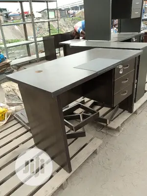 A Four Feet Table With Pad