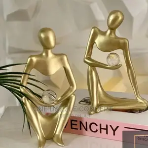 Gold Figurine With Crystal