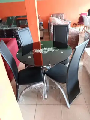 Quality 4 Seater Tempered Glass Top Dining Table Set.