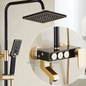Gold and Black Shower Mixer With Buttons