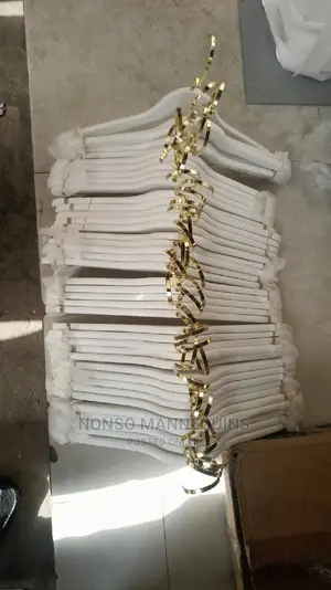 White and Gold Wooden Clothes Hangers