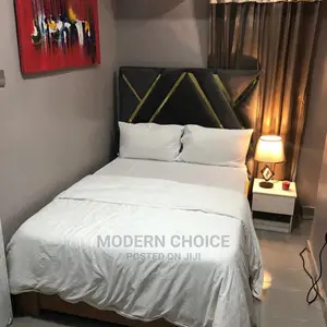 4,6 by 6 Bed and Side Cupboard Up for Grab