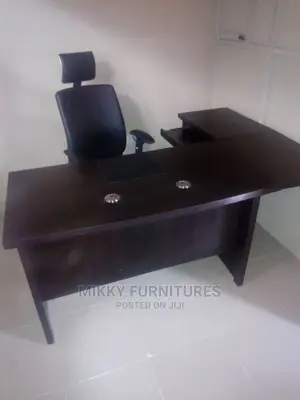 Executive Office Table and Swivel Chair.