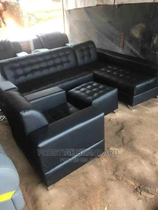 A Seven Seater of Leather Sofa, With Center Table