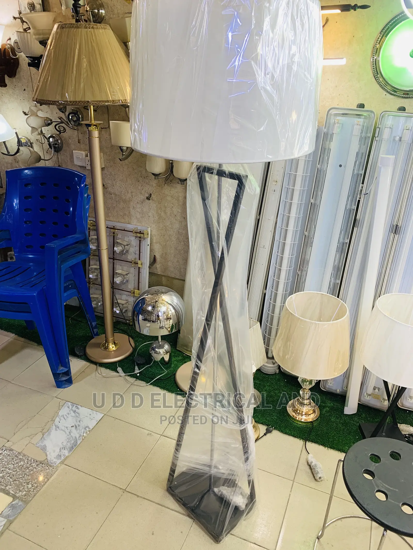 Executive Standing Beside Lights