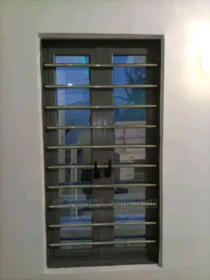Gray Casment Window and Stainless Steel Burglary
