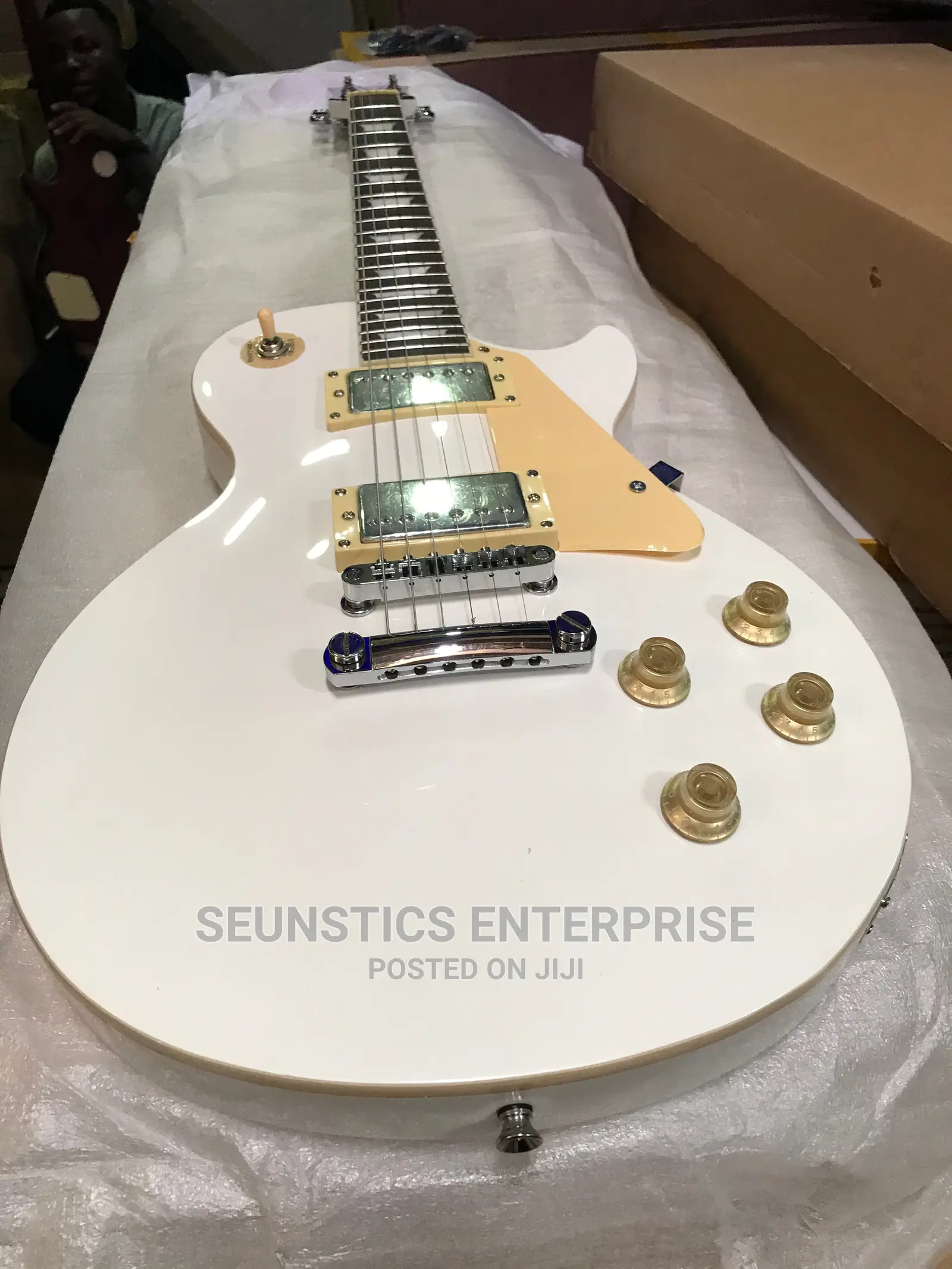 White Gibson Les Paul Style Guitar