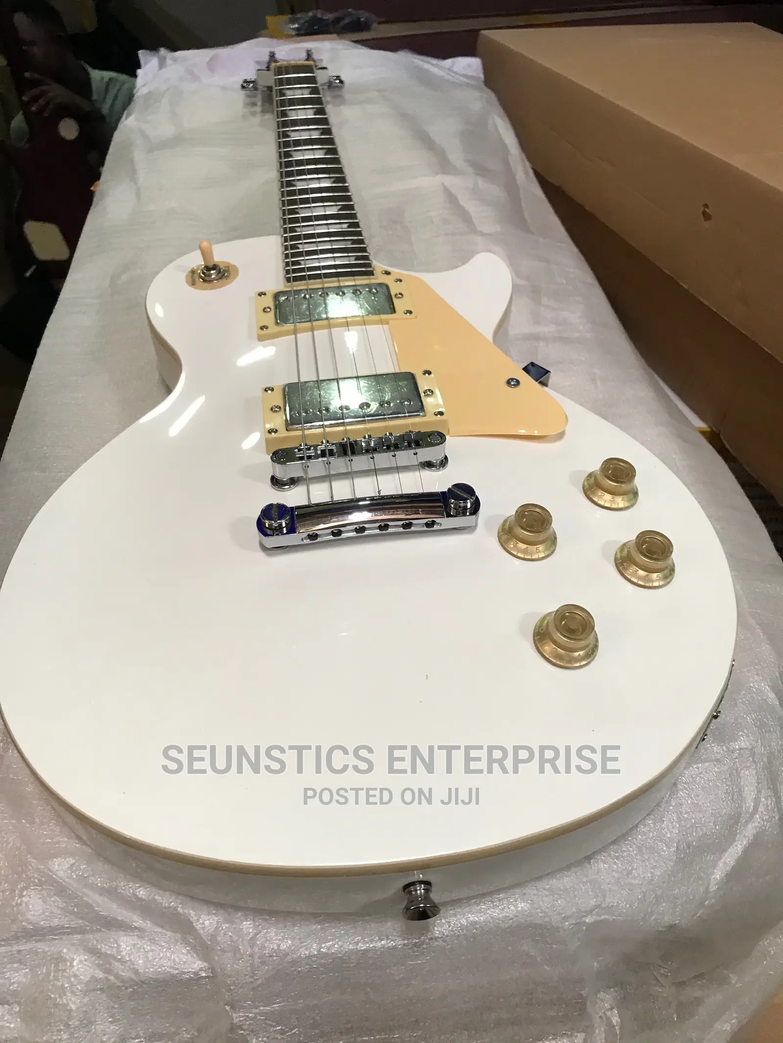 White Gibson Les Paul Style Guitar