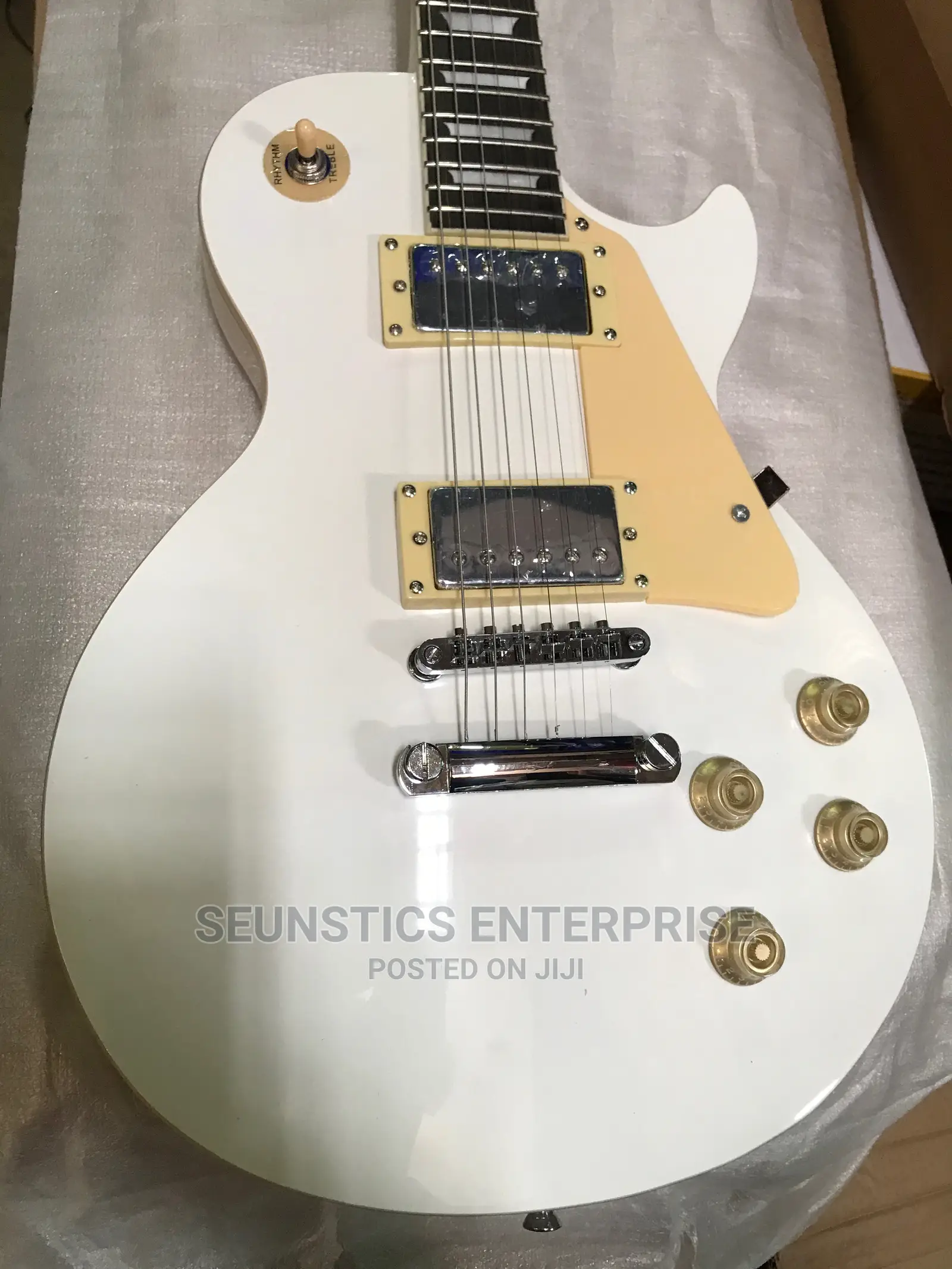 White Gibson Les Paul Style Guitar