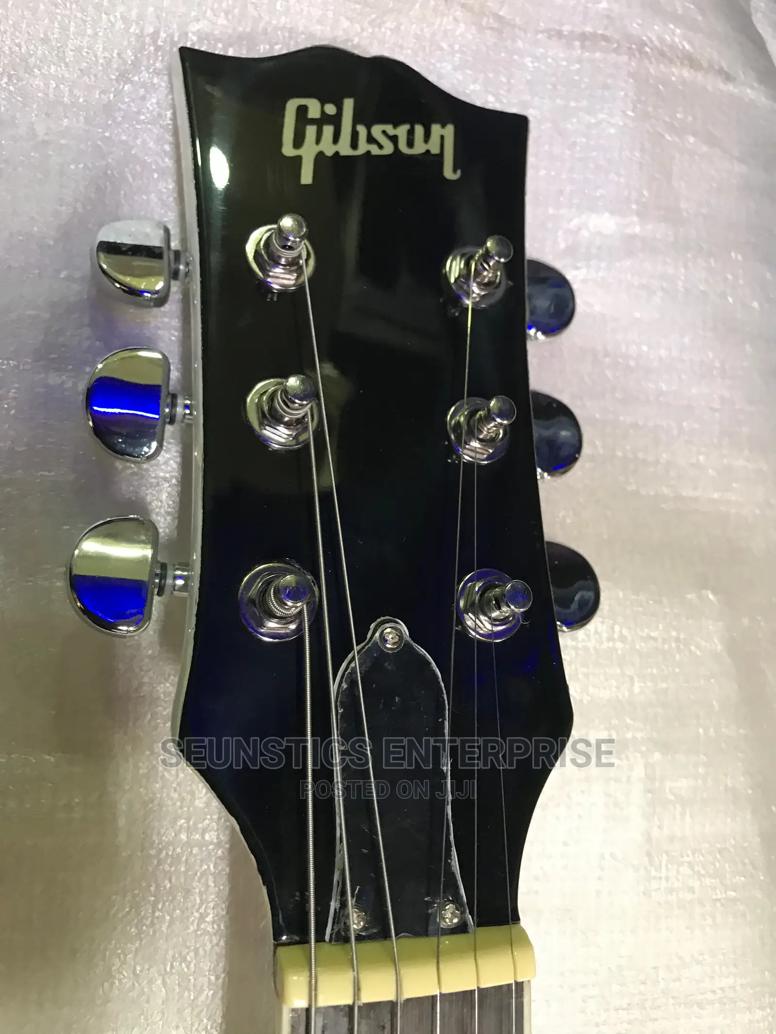 White Gibson Les Paul Style Guitar