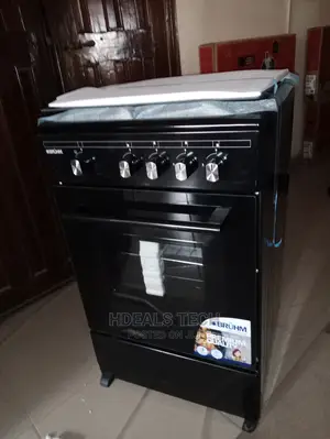 A Black Color Bruhm Gas Cooker 3 Gas and 1 Electric