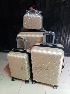 Set of 4 Golden Rubber Plastic Traveling Luggage Boxes