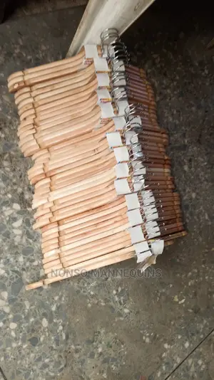 Photo - Clean Neat Wooden Clothes Hangees for Displaying Clothes