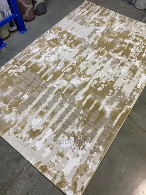 Mixed Brown and Cream Designs Center Rugs 7/10