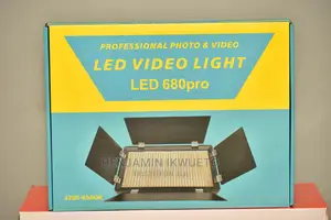 Video Light With Batteries, Charger, and Power Cord.
